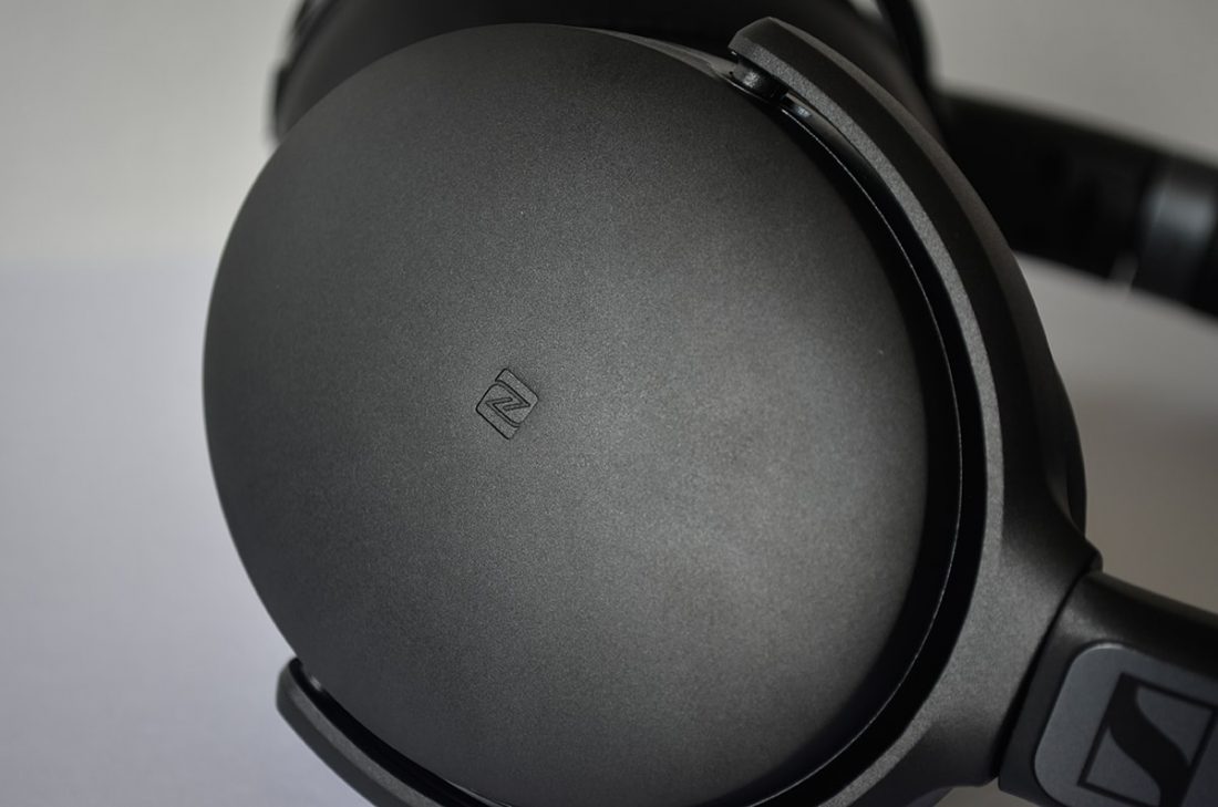 The "N" logo signify the NFC location on the headphones.