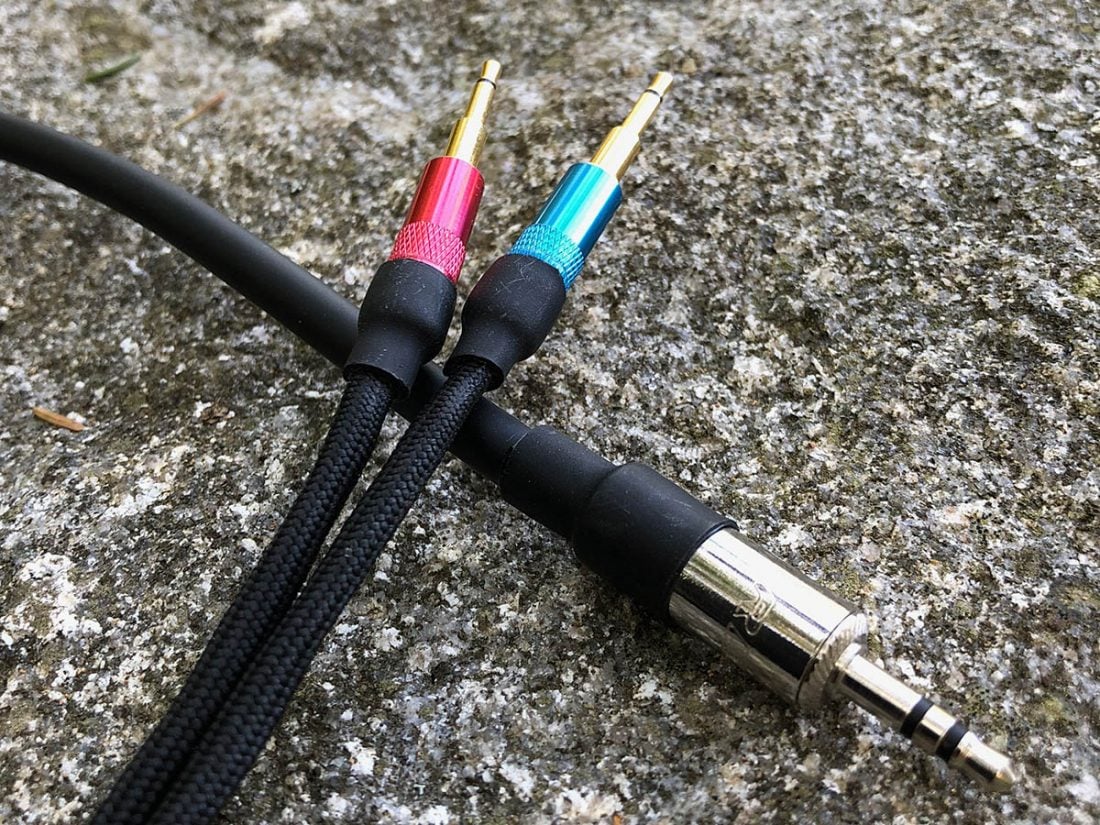 A photo of my DIY cables using Mogami microphone wire, Neutrik Reen 3.5mm stereo connector, 2.5mm headphone cup connectors, paracord sheathing and shrink wrap.