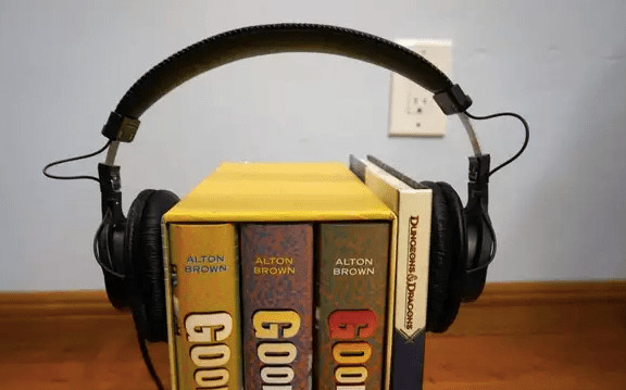 Stretching the headphones over a DIY stretching rack made from books