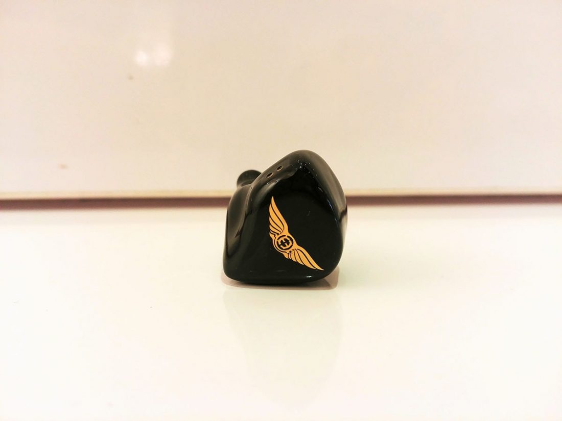 Gold Empire Ears logo on black acrylic shell