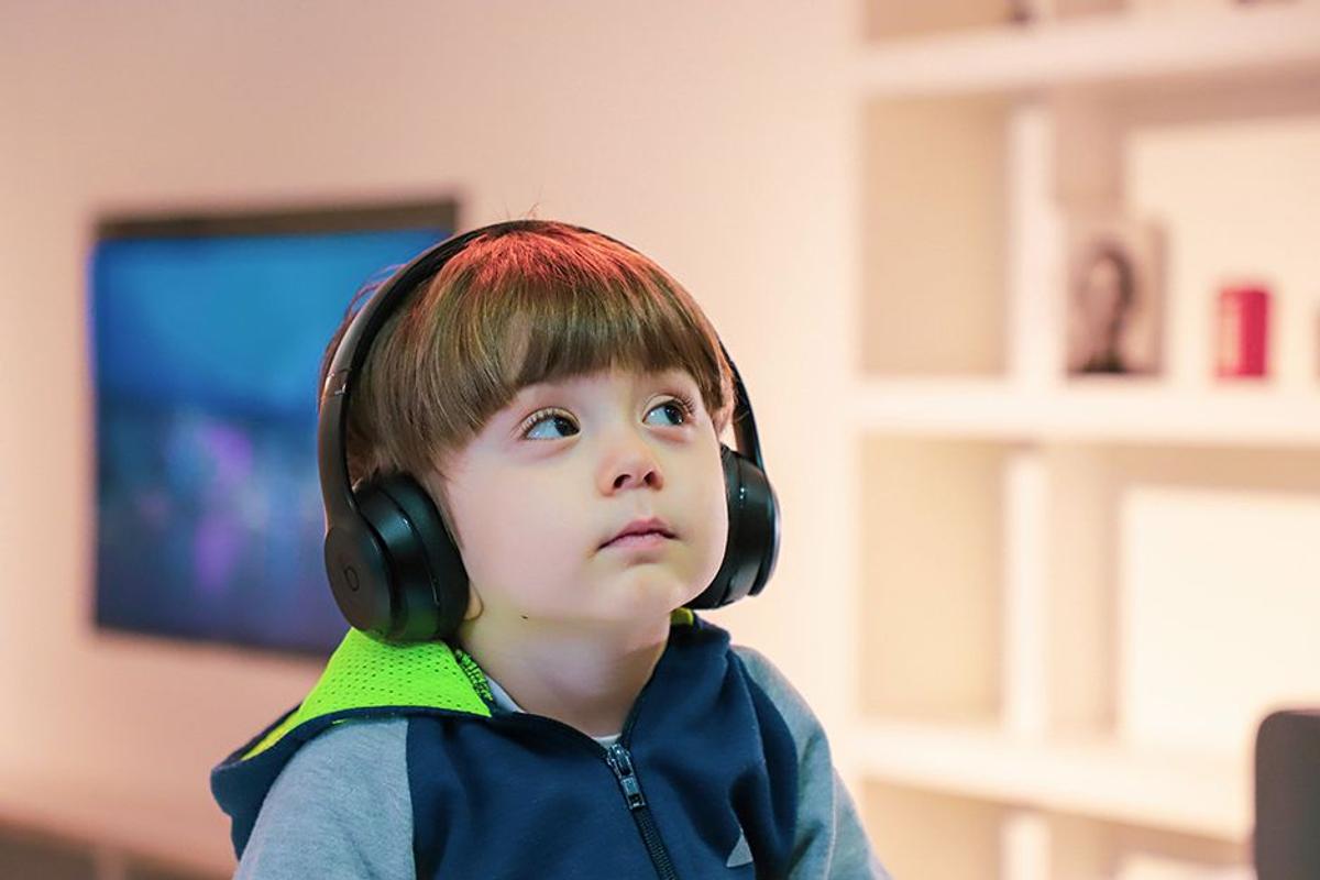 Little boy using headphones (from popsci.com)