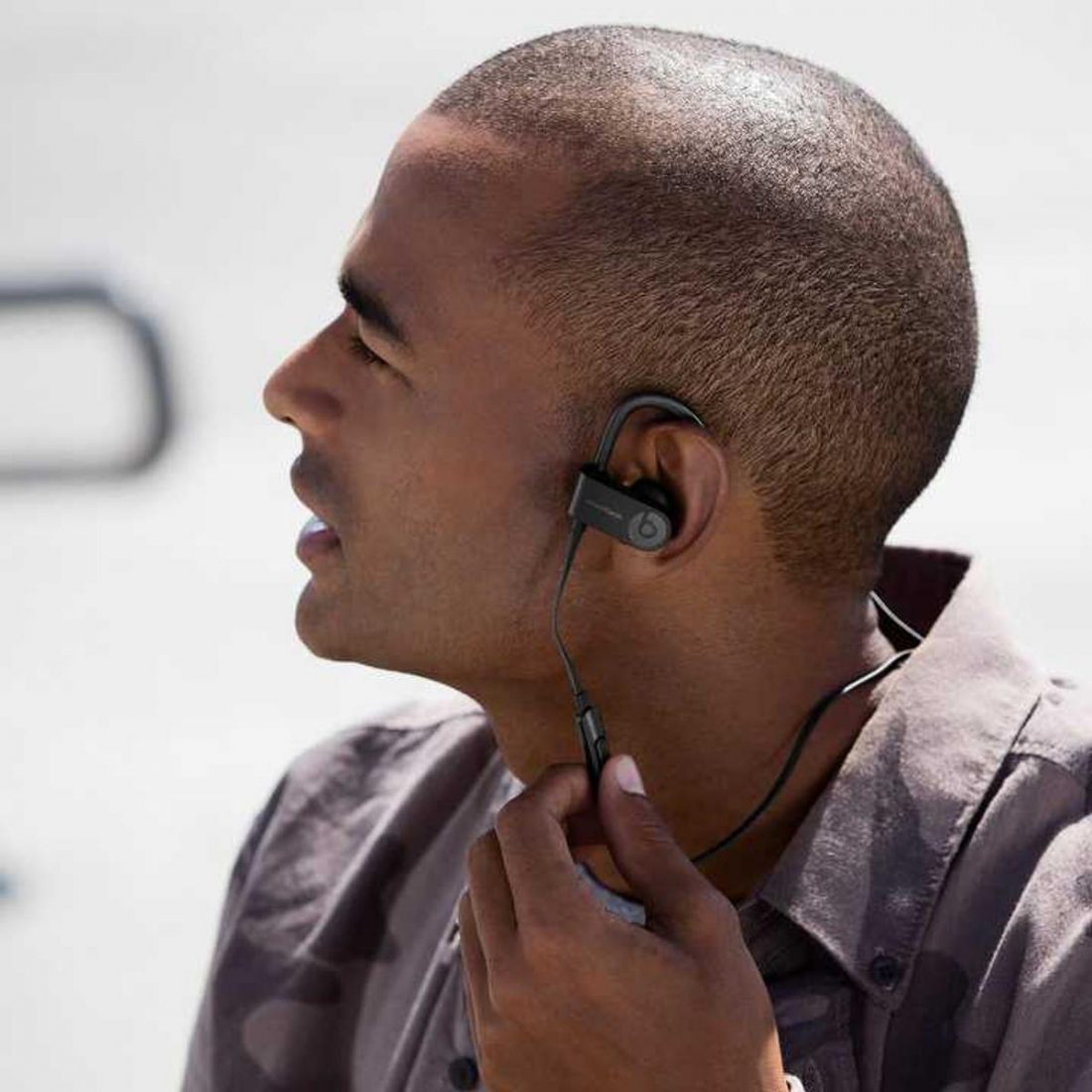 Man wearing Powerbeats3 Wireless (From: Beats by Dre)