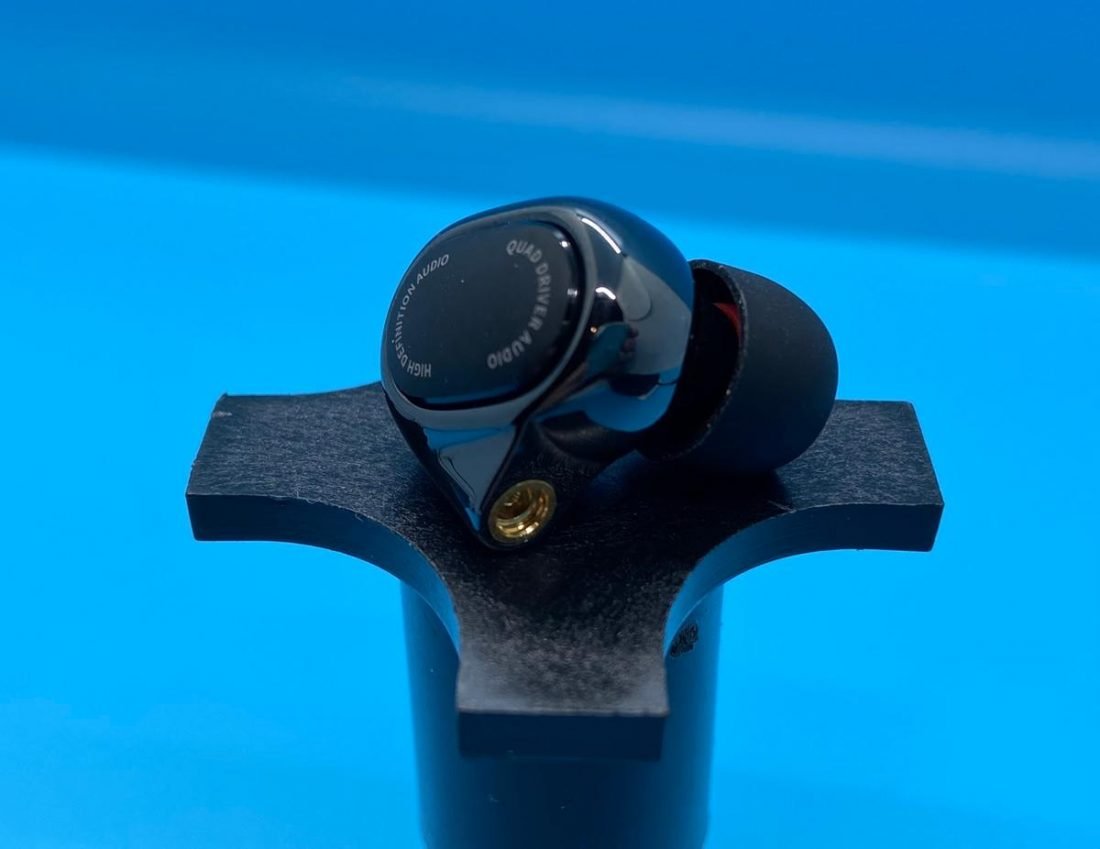 Detailed photo of the MiQuad Earbud detailing finish, MMCX jack, and eartip.