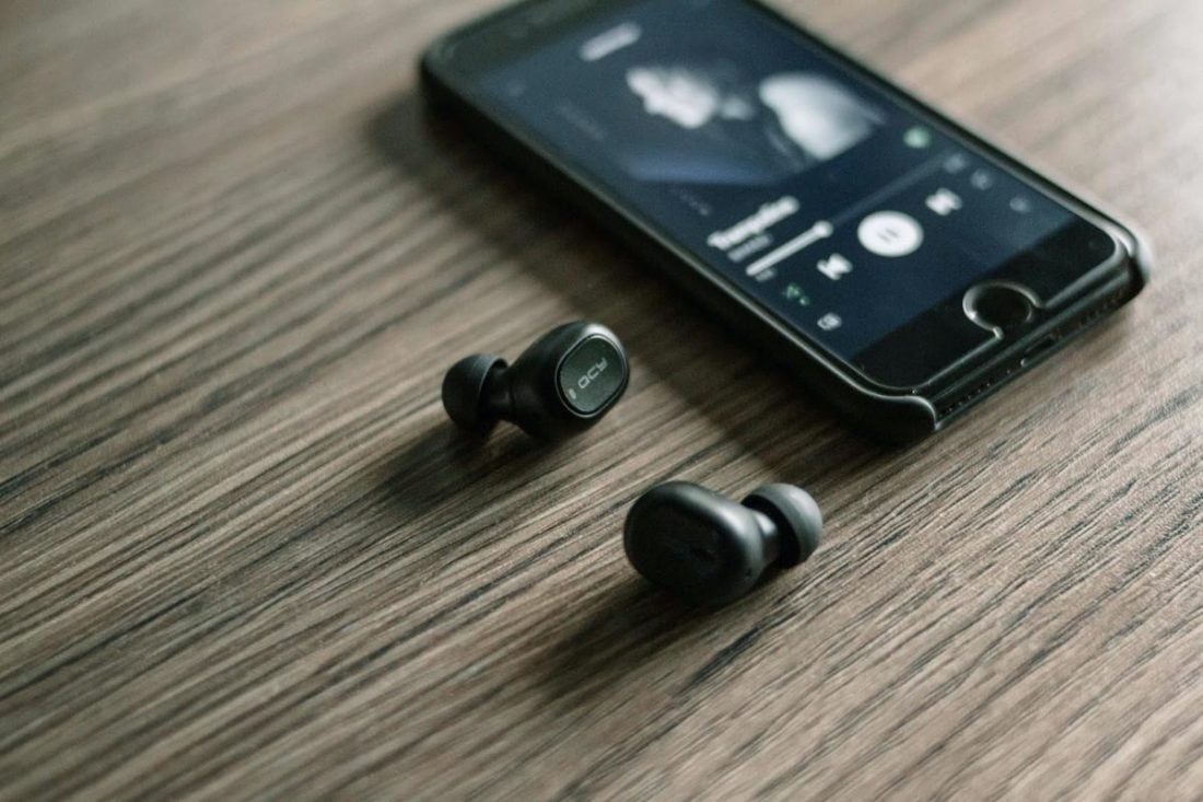Bluetooth headphones paired with smartphones (From Unsplash.com)