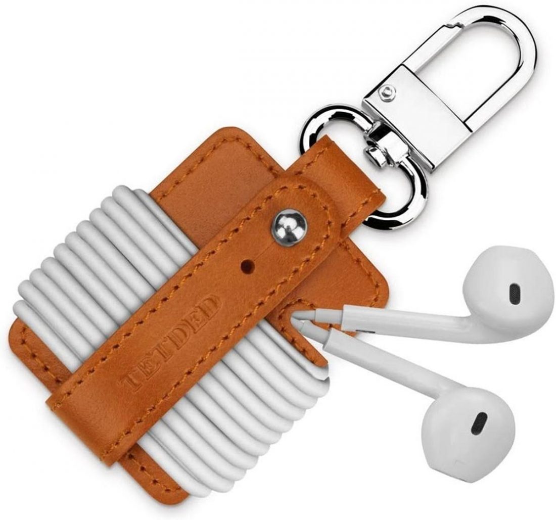 The TETDED Premium Leather Earphone Holder offers you a stylish way to organize your wires. Use the metal buckle to hang it on your bag or clothing. (From: Amazon)