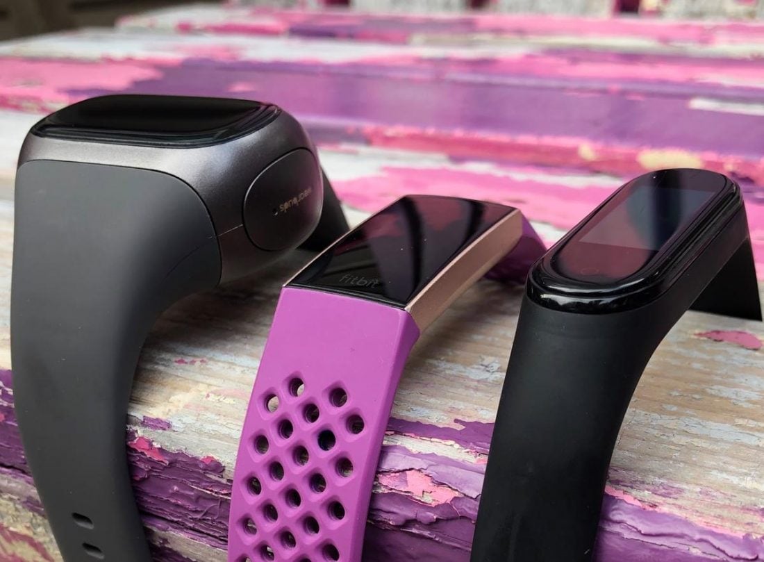 A comparison of the size of the Wearbuds Pro (left) a Fitbit Charge 2 (center) and Xiaomi Mi Band 4 (right).