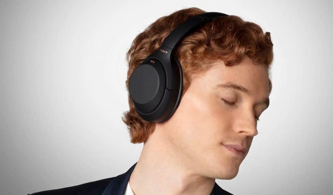 A model wearing the over-ear Sony WH-1000XM4 correctly (From: Sony.com)