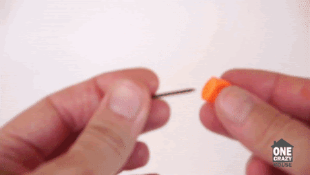 Inserting nail into earplug (From:OneCrazyHouse Youtube).