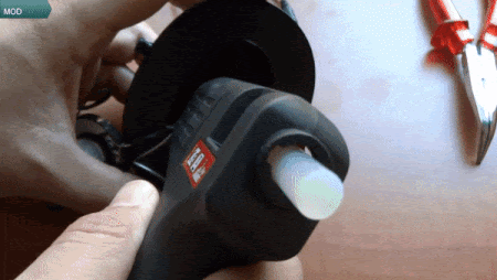 Gluing speaker inside headphone (From:HTibor DIY Youtube).