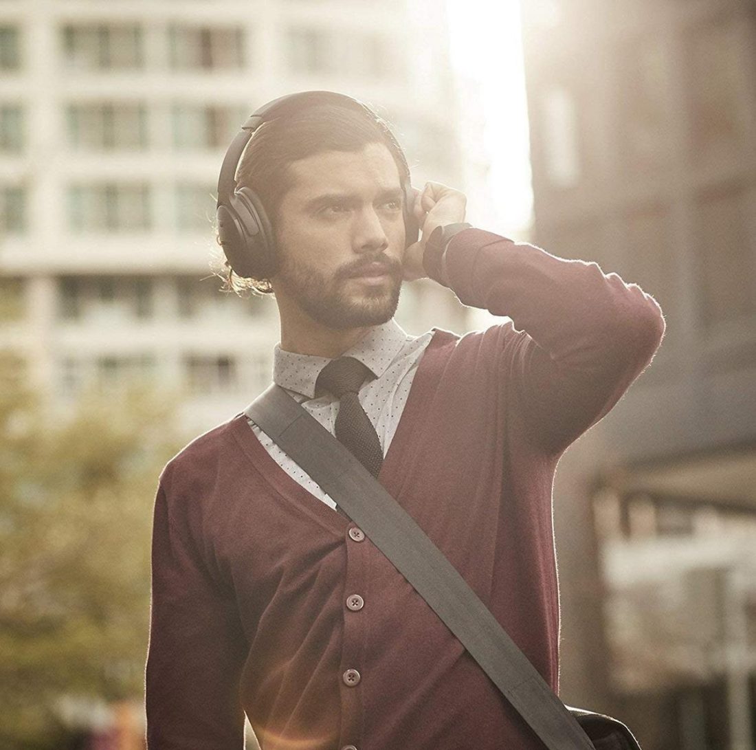 Man wearing Bose QC35ii Headphones - best noise cancelling headphones under $300 (From: Amazon)