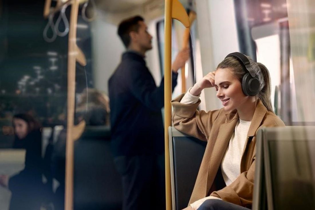 Woman wearing Jabra Elite 85h Headphones in the subway - best noise cancelling headphones under $200 (From: Lazada)