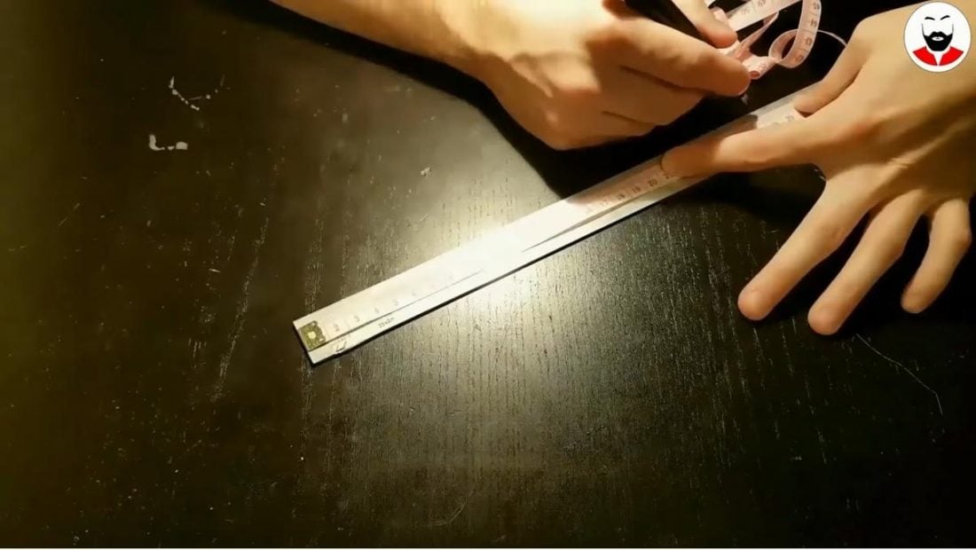 Measuring the length and dimensions on the aluminum flat bar. (From: Youtube/GaBIT)
