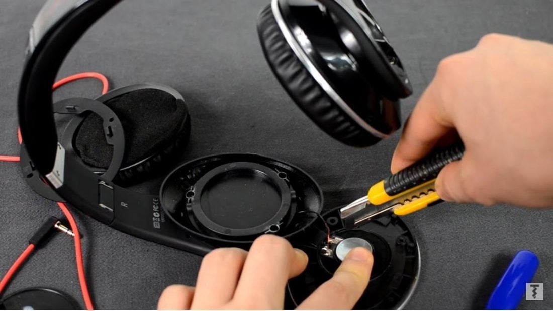 Using a small tool, remove the broken headphone driver. (From: Youtube/Techscrew)