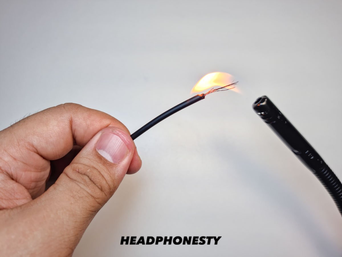 Burning off enamel coating on headphone wires.