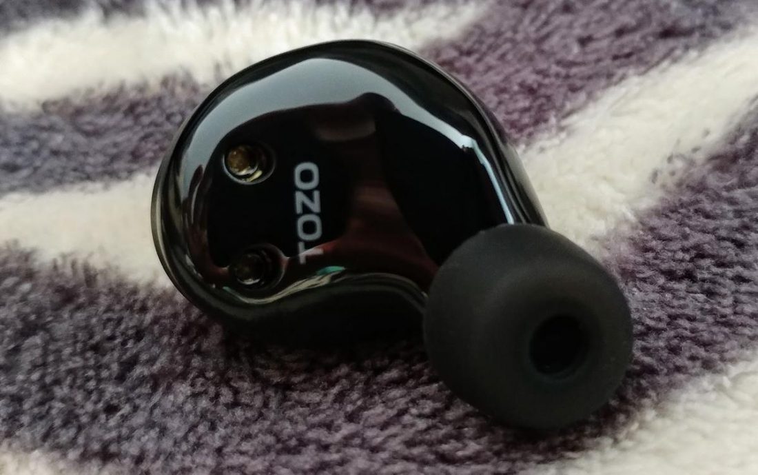 The TOZO logo, only featured on the inside of the earphone body