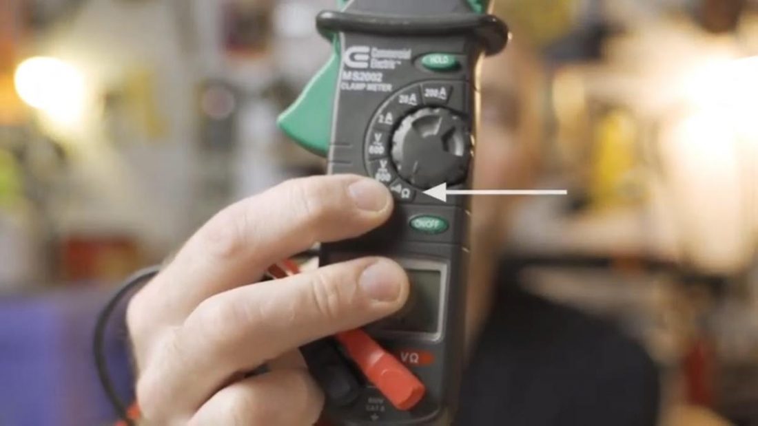 Multimeter with arrow pointing to 'Continuity' button (From: Marcus Hutsell/YouTube)