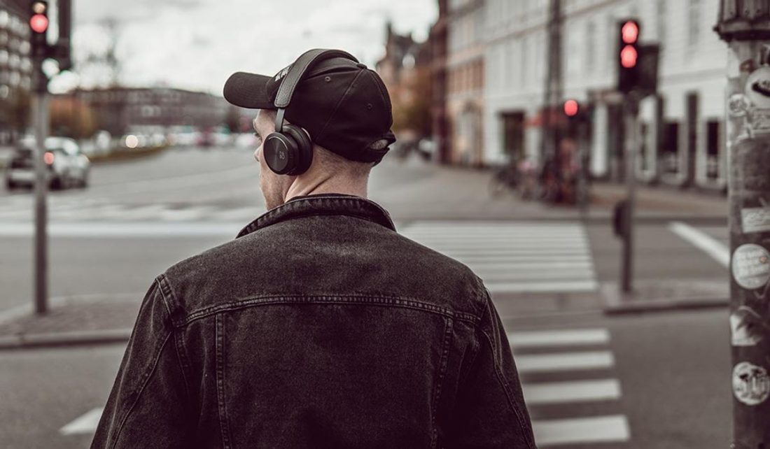 Man wearing wireless headphones (From: Pexels)