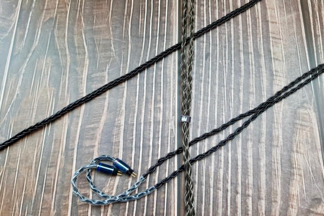 The black cable is the stock cable for the standard Sultan, and the brown, thicker cable is the stock cable for the Damascus Edition.