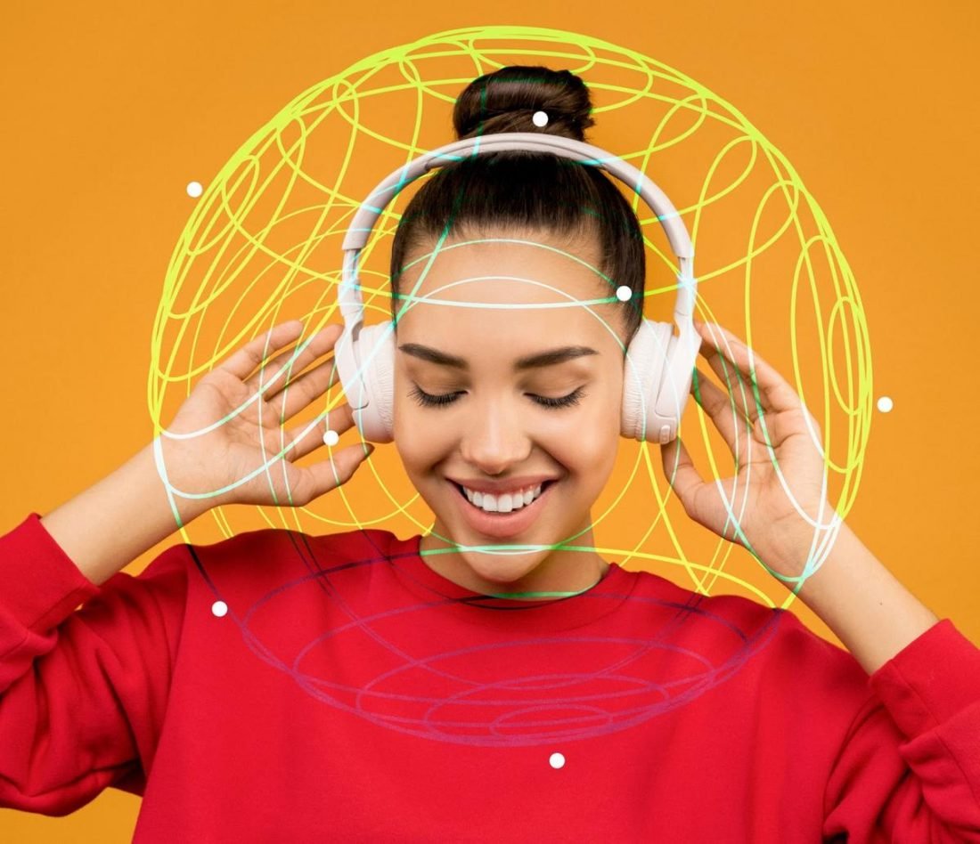 Woman enjoying spatial sound in headphones (From: Pexels)