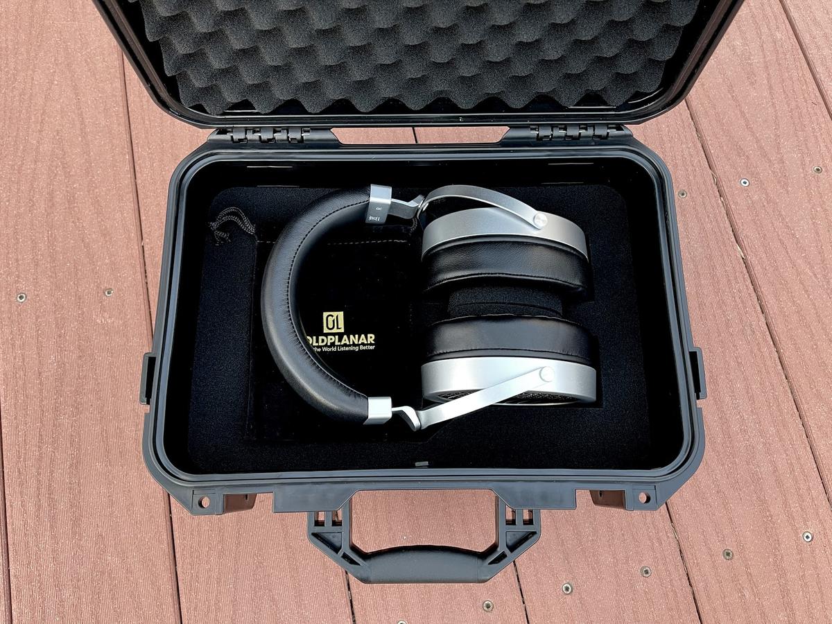Headphones in their travel case
