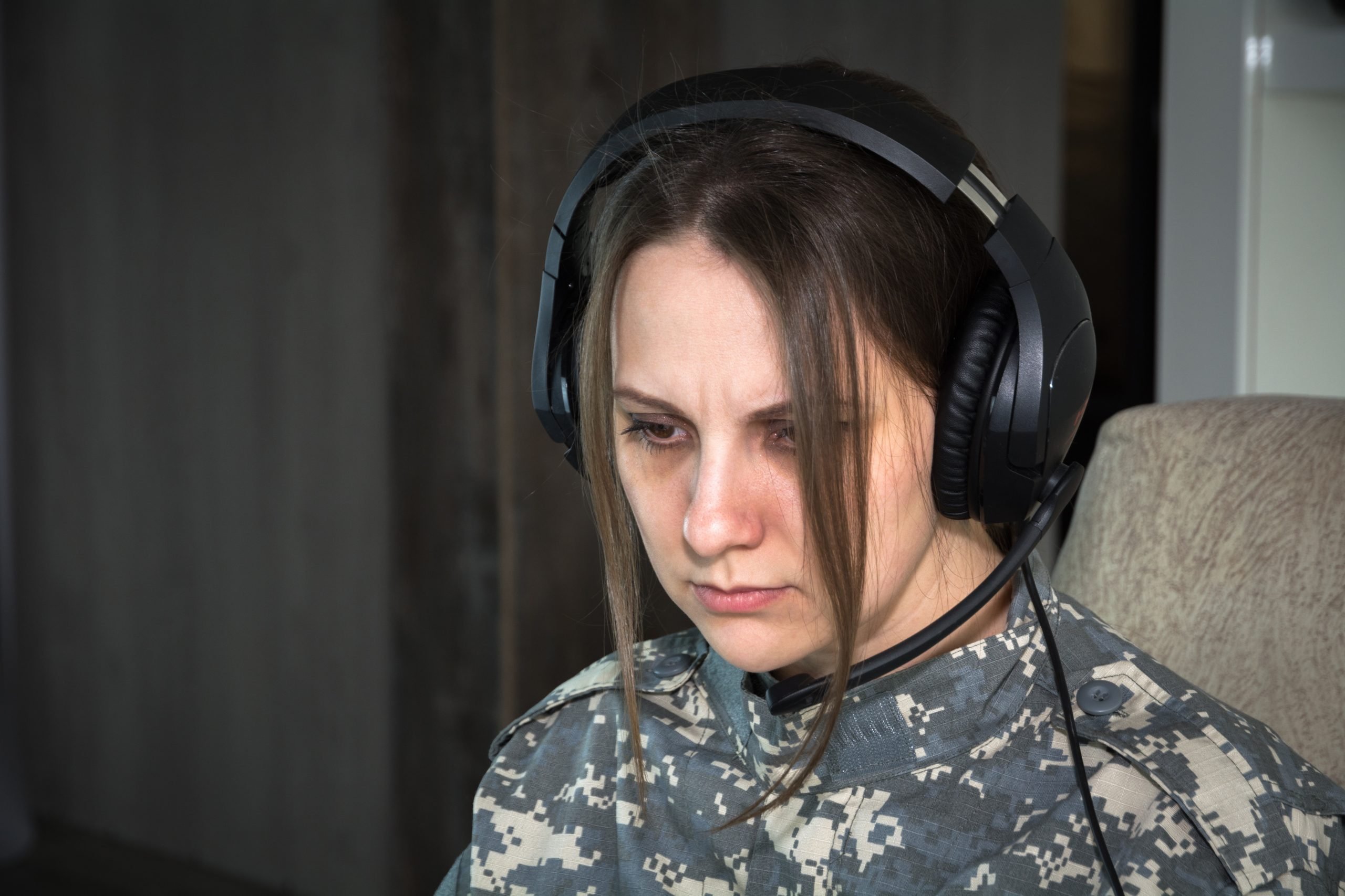 Woman frustrated while wearing headphones (From: Unsplash)