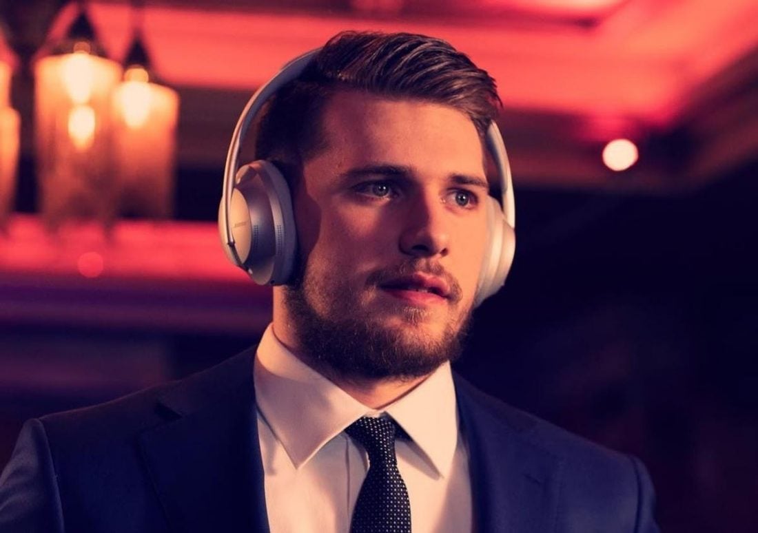 Luka Doncic wearing a suit and his Bose 700. (From: Instagram/@lukadoncic)