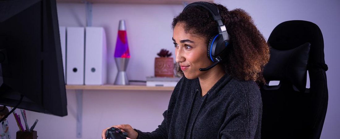 Girl wearing Turtle Beach Stealth 700 while playing (From: Amazon)