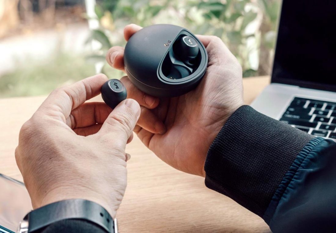 Charging wireless earbuds (From: Pexels)