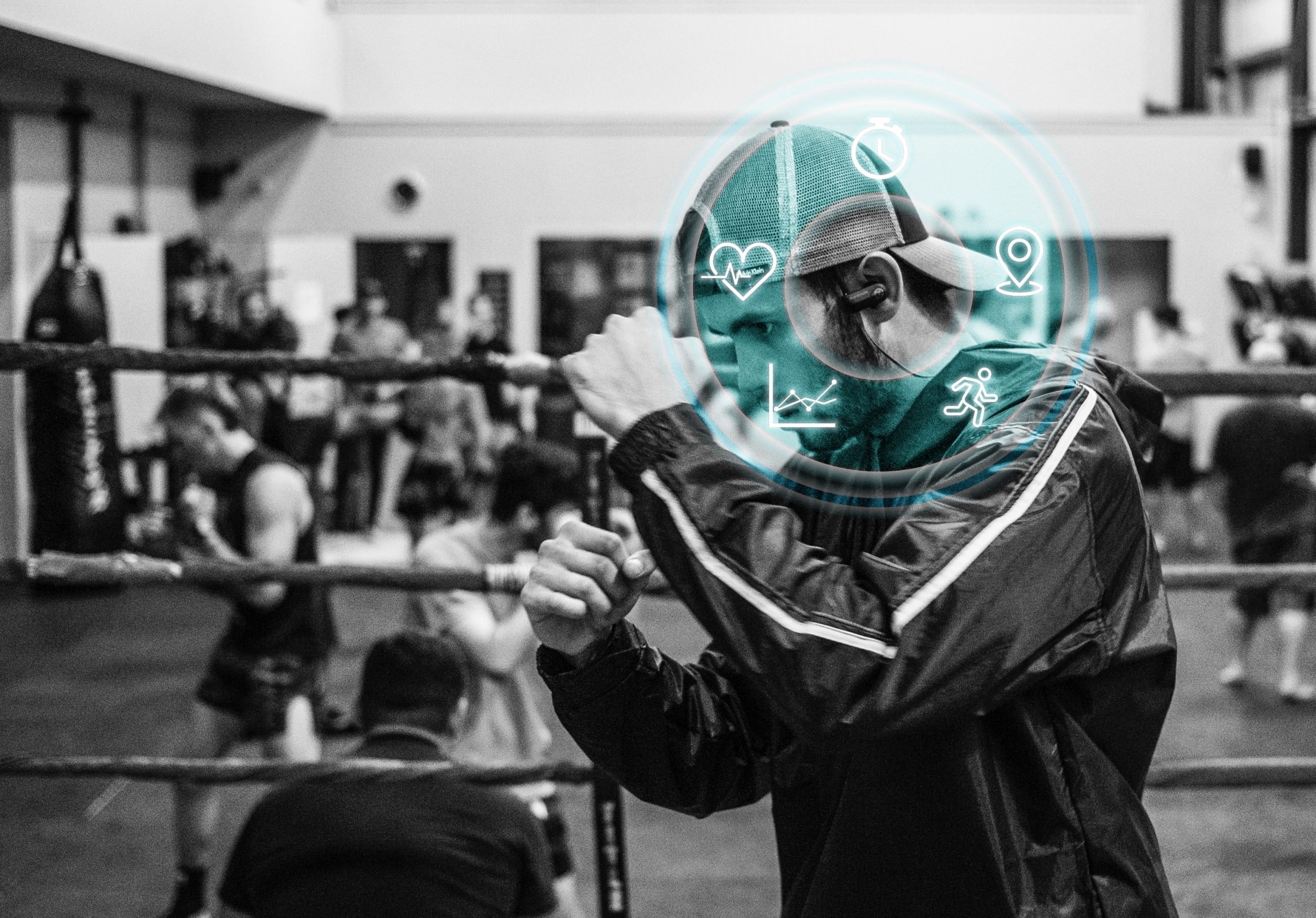 Man wearing heart rate headphones while boxing (From: Unsplash)