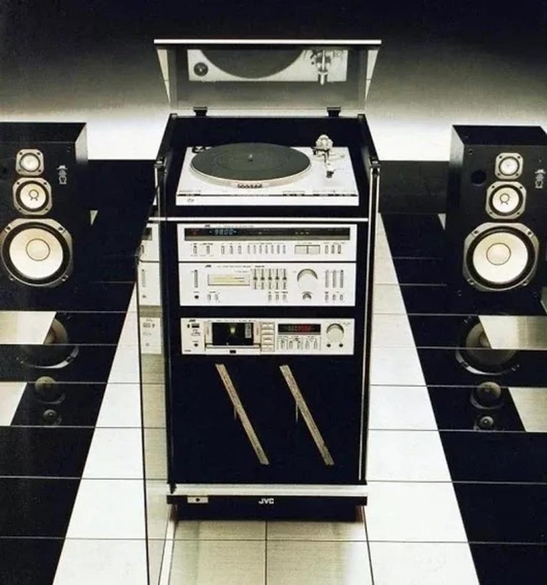 Tuner, turntable, tape deck and receiver, all in a large rack made specifically for the set. They don't make audio equipment like they used to. (From: 1001Hifi.com)