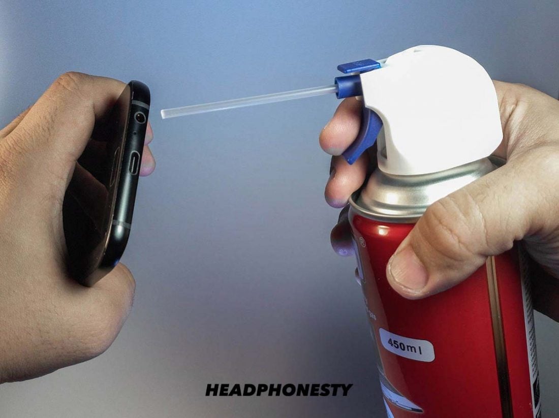 Point compressed air nozzle to headphone jack