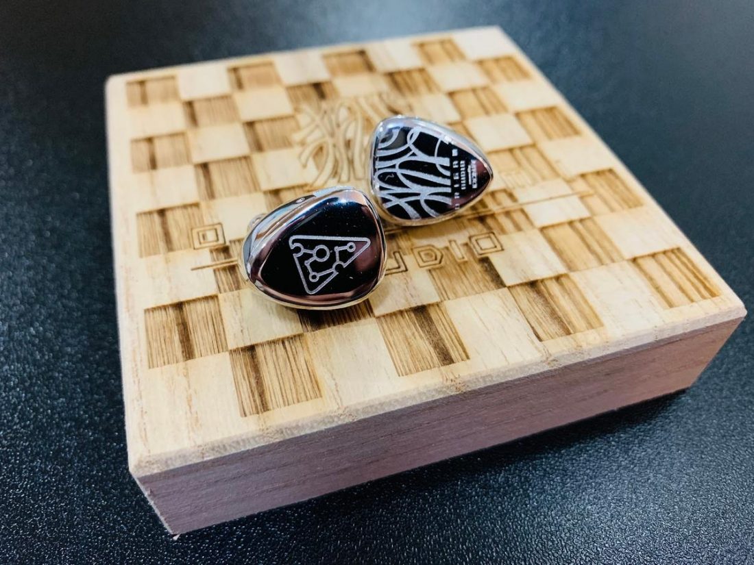 Origami Audio Silver on top of their wooden box.