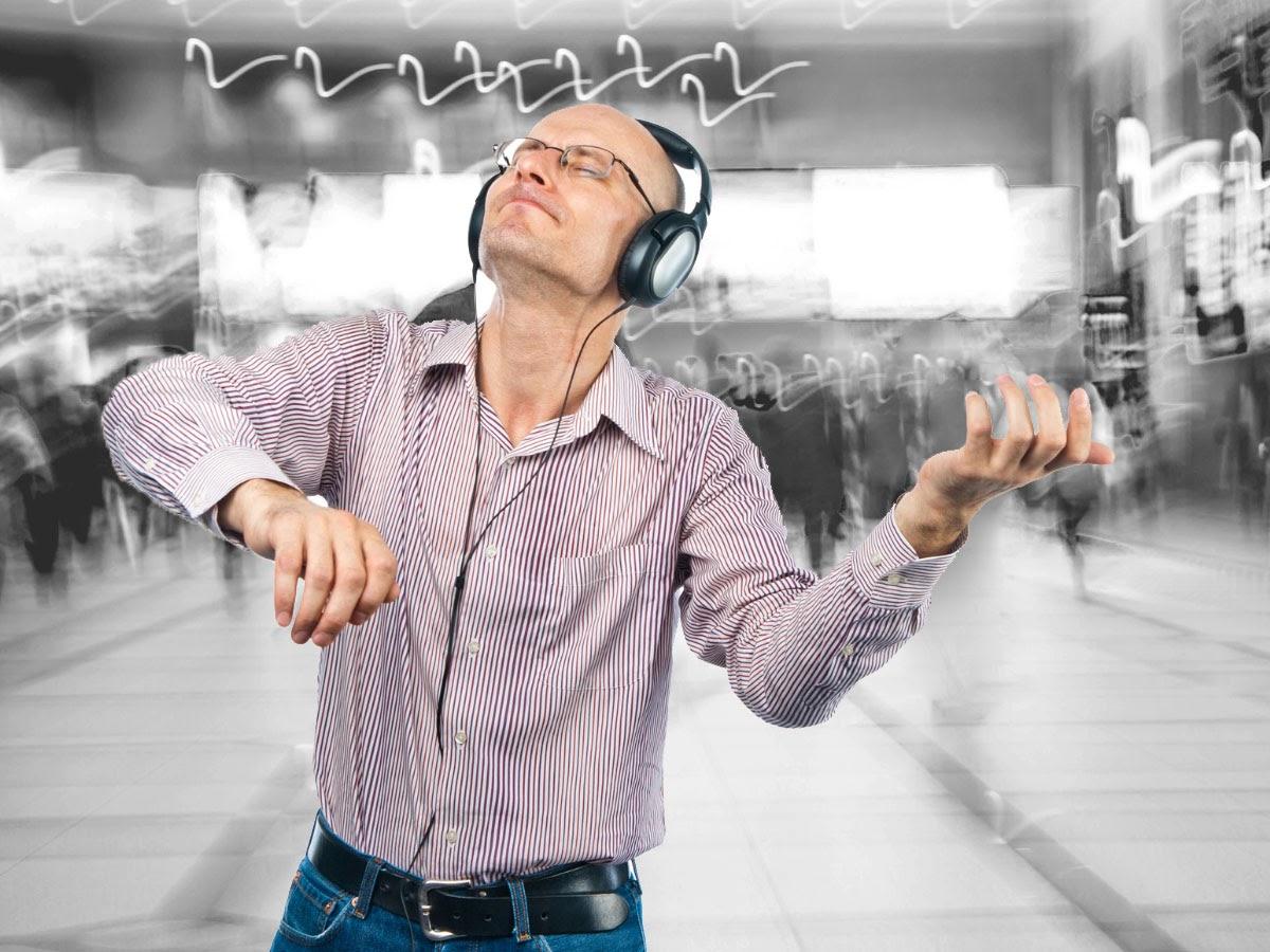 Man listening to classical music via headphones