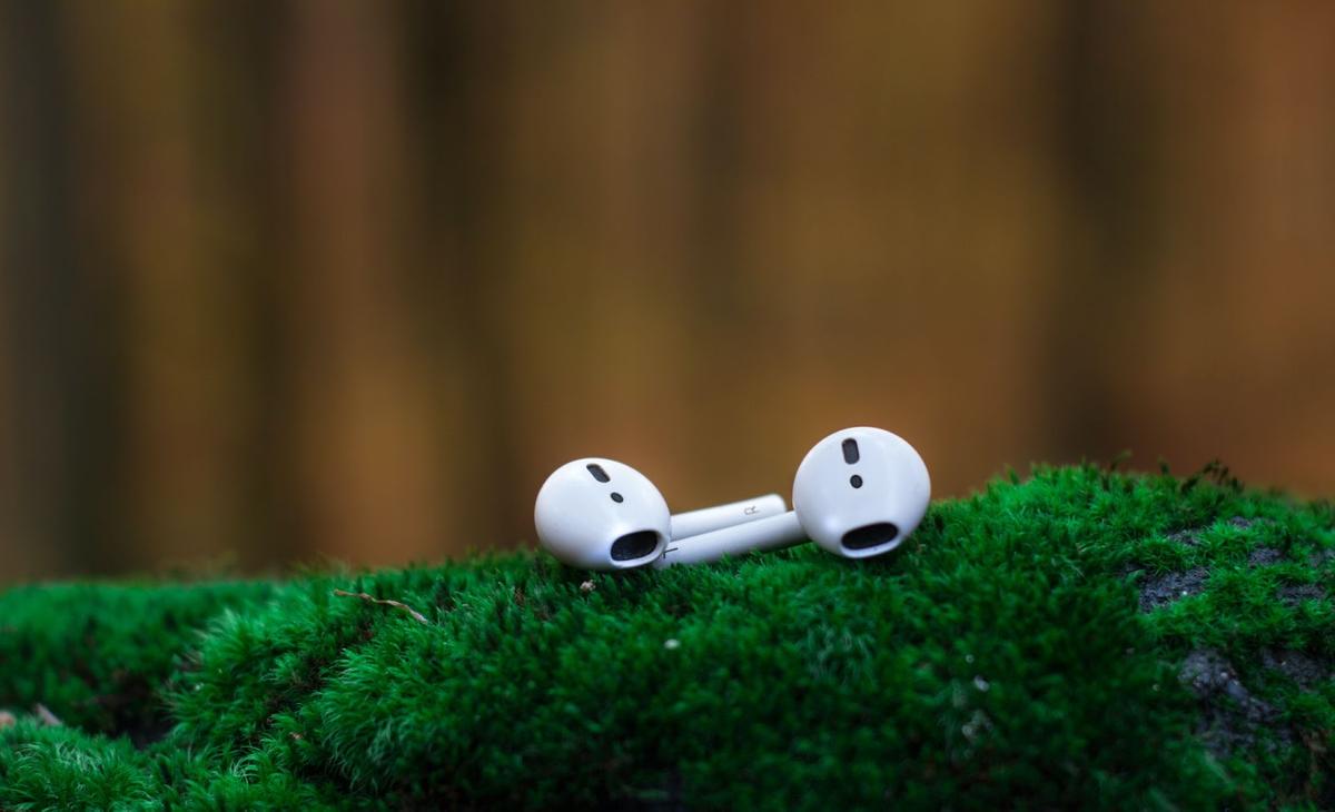 AirPods on a grassy field