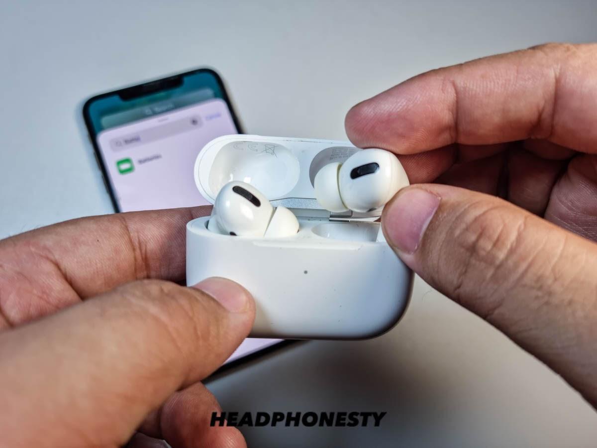 Putting AirPods back on case