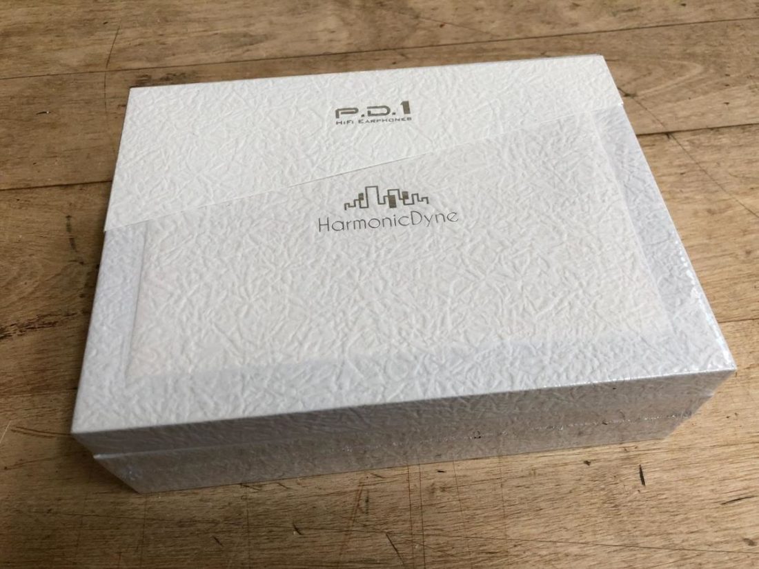 The box is constructed of textured white paper.