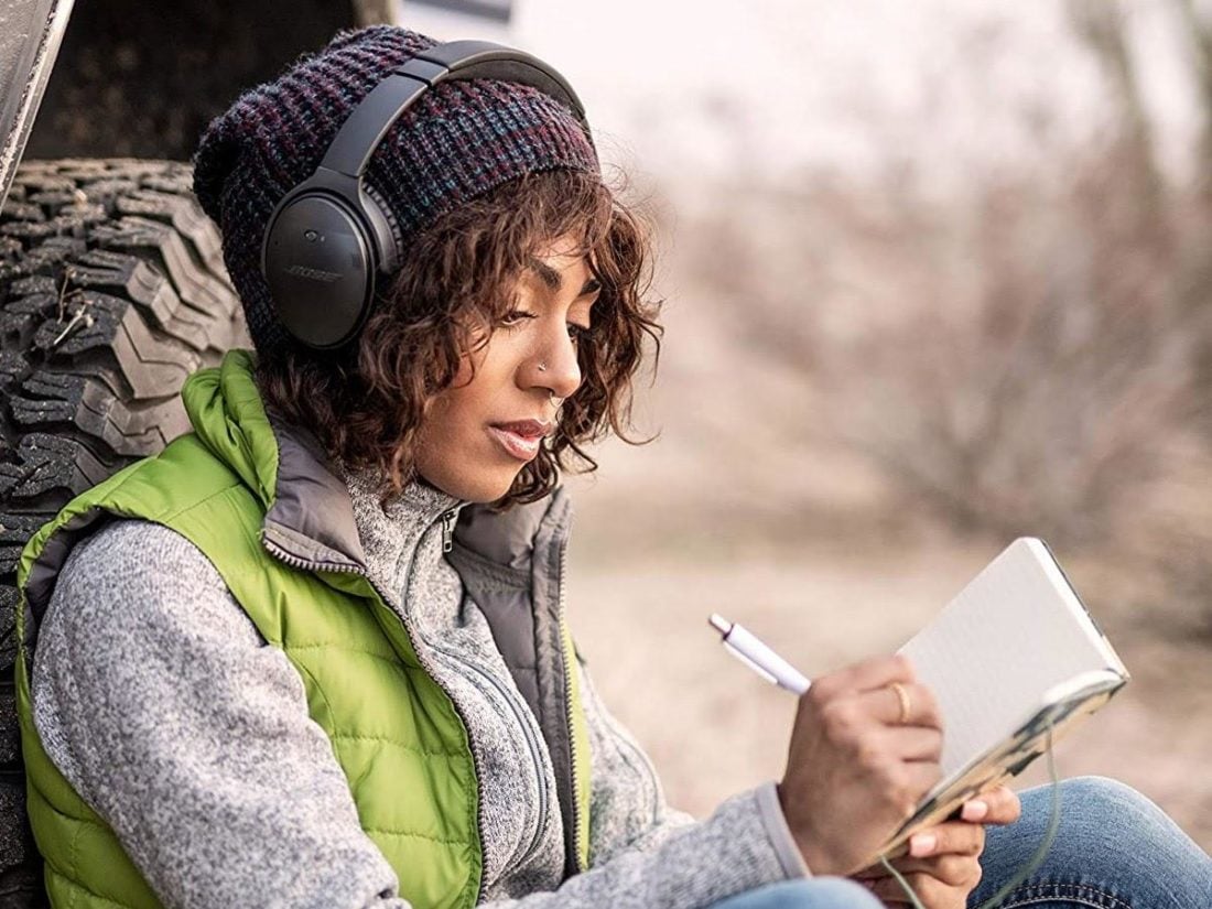 Woman wearing Bose headphones (From: Amazon)