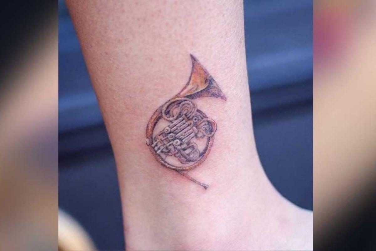 A hand-poked french horn. (From: TattooFilter/Gallery Arles)