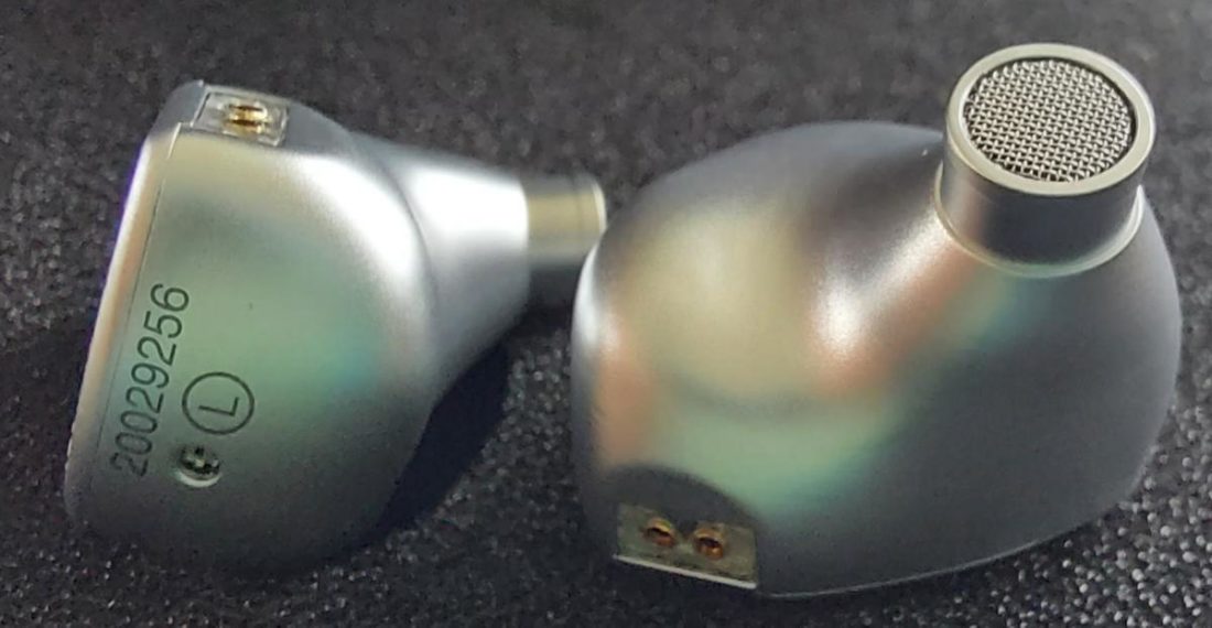 The ergonomic shells, while not small, fit very well and feel secure in the ears