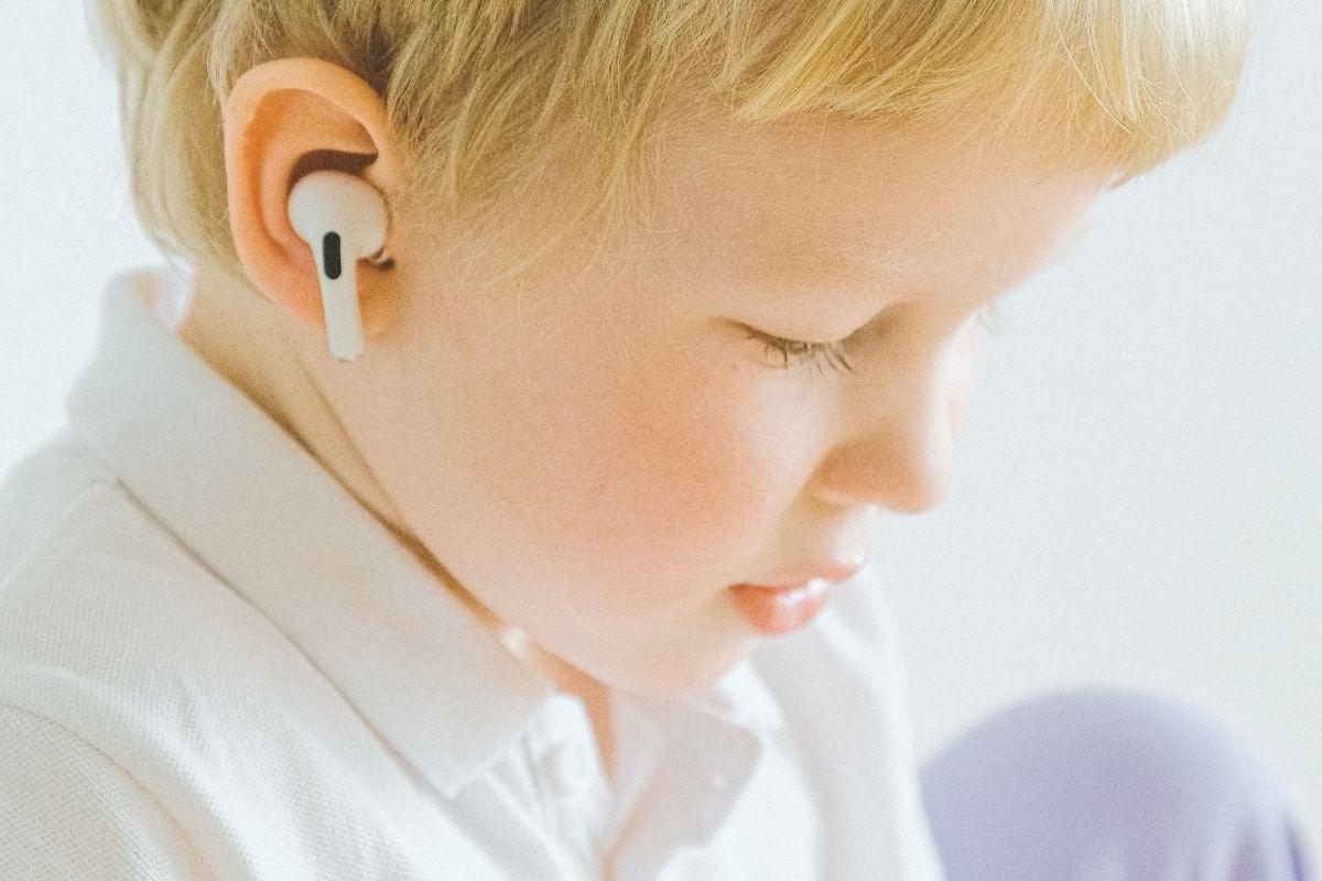 Child wearing earbuds