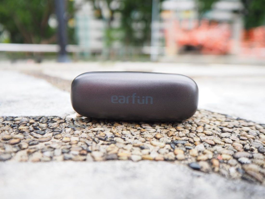 The top view of the charging case - the Earfun logo is printed on the lid.