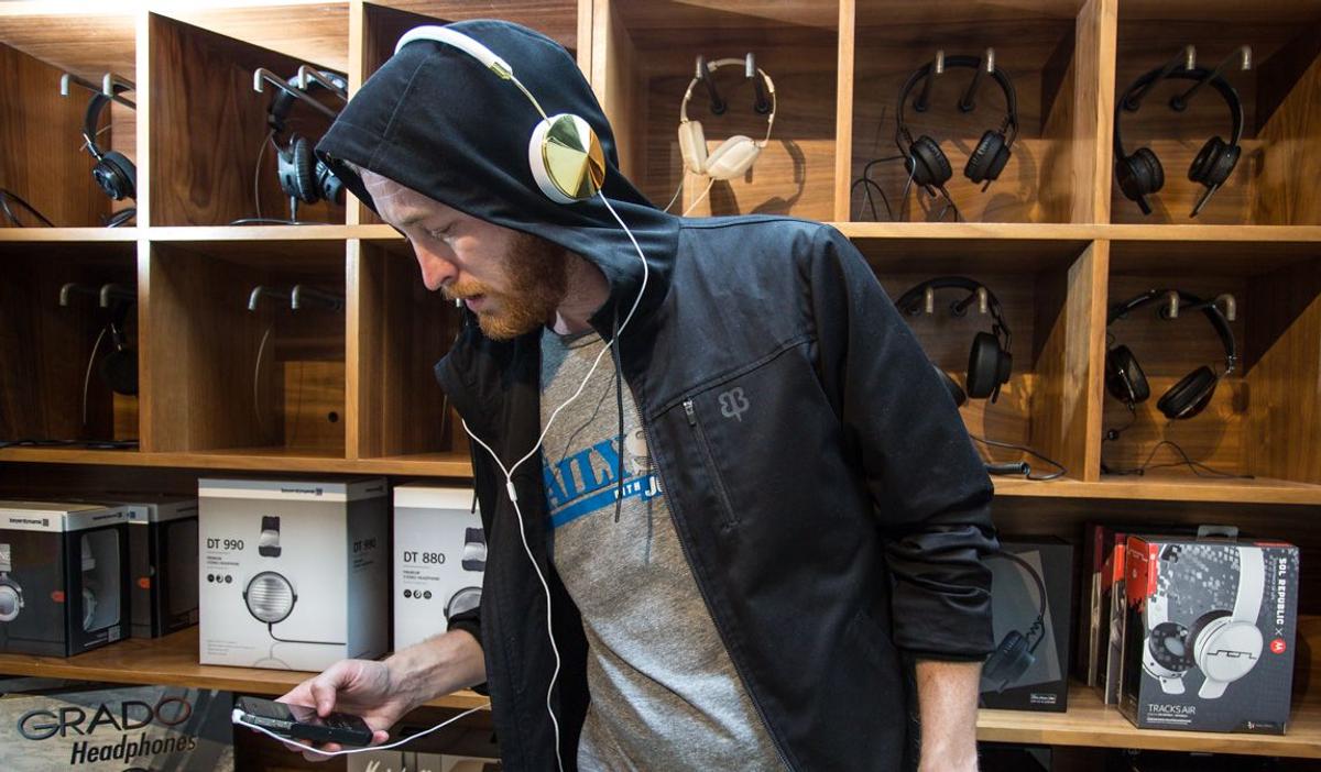 Man wearing headphones over hoodie (From: Betabrand)