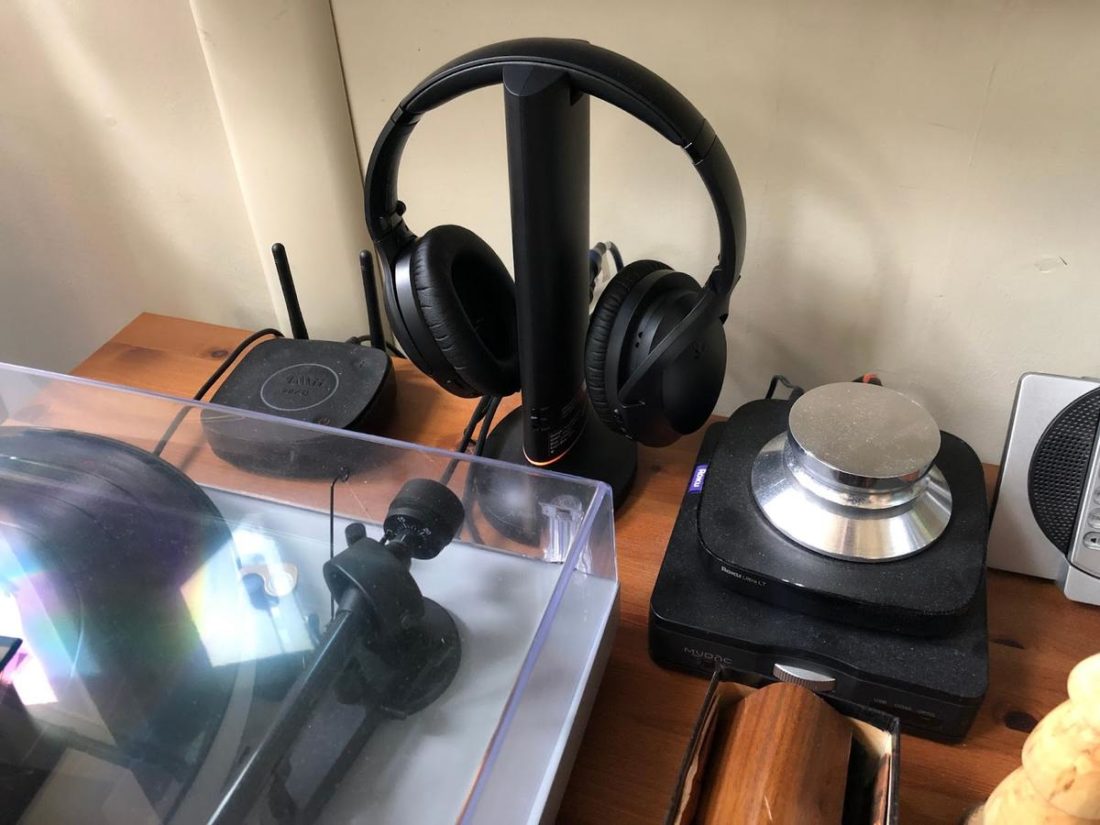 The headphones and base tuck away near the TV.