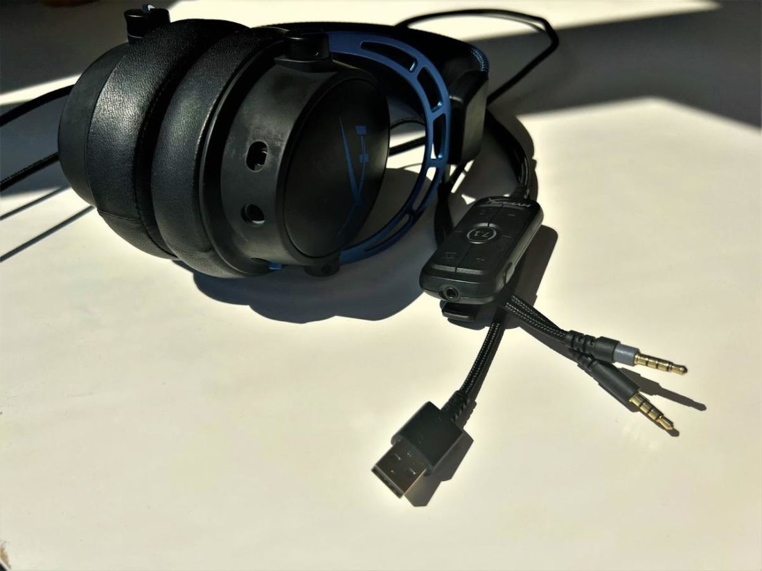Connection ports on the outside of left ear cup and the USB audio control mixer.