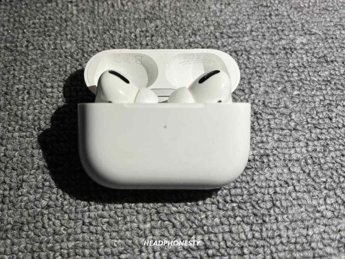 Place each separately paired AirPod back in the case and close the lid. Status light will flash amber at this point.