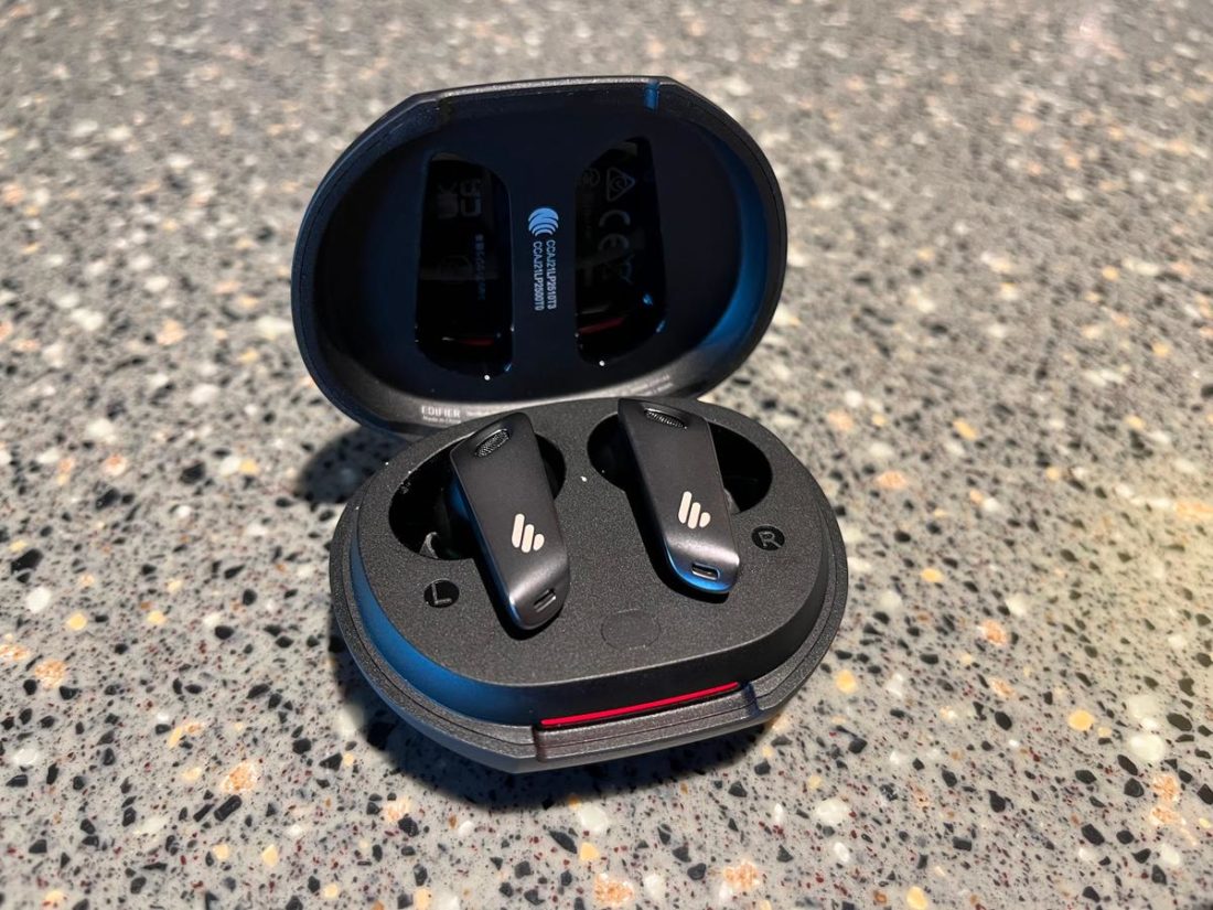 The earbuds turn on when the case is opened, and they will connect to the last paired device immediately.
