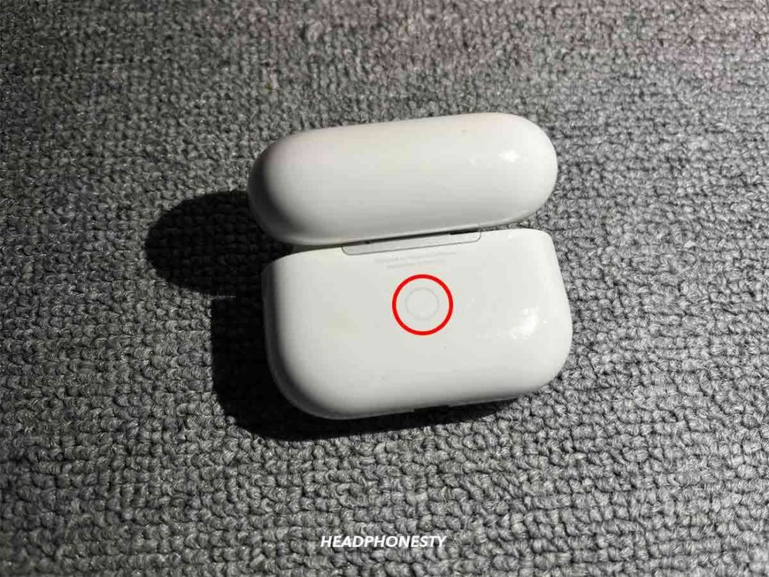 Make sure the charging case lid is open. Now press and hold the Setup button till the light flashes white.