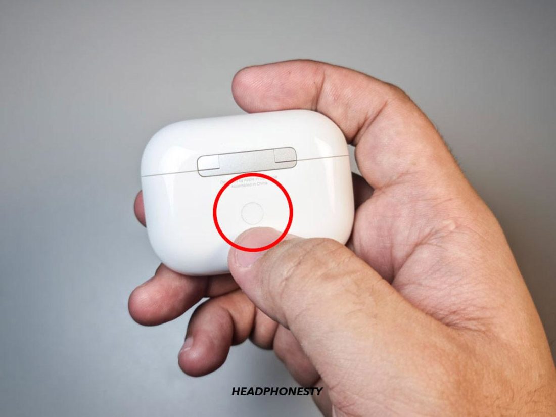 Press and hold the Setup Button on the back of the charging case the status light flashes white