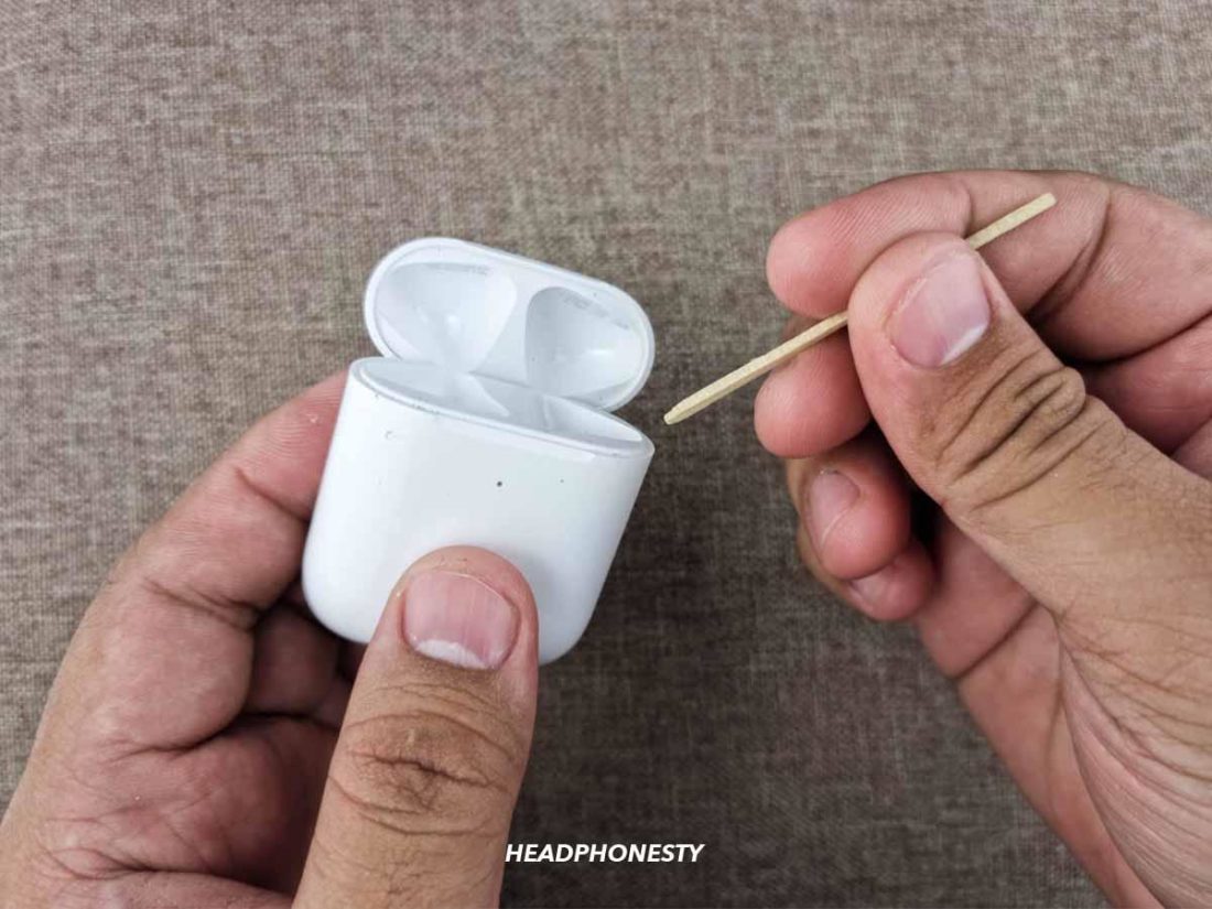Wooden toothpick dipped in isopropyl alcohol to remove remaining dirt.