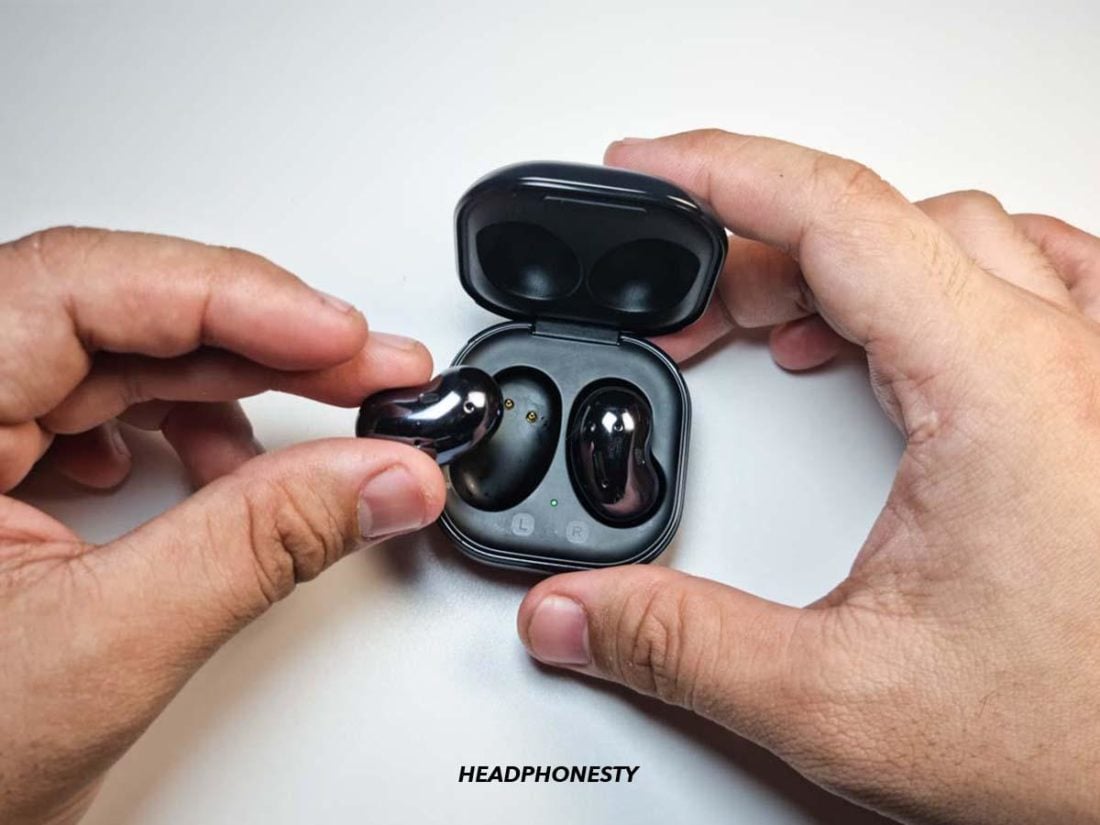 Galaxy buds positioned in the charging case.
